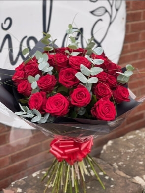 Stunning long stem red roses with eucalyptus
